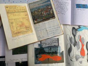 a collection of artists journal with pasted in photos, drawings, and text