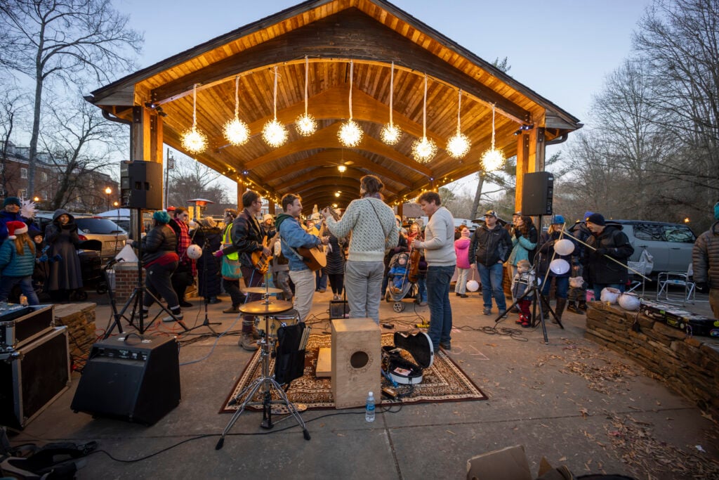 Band performing in front of crowd at last year's Solstice walk