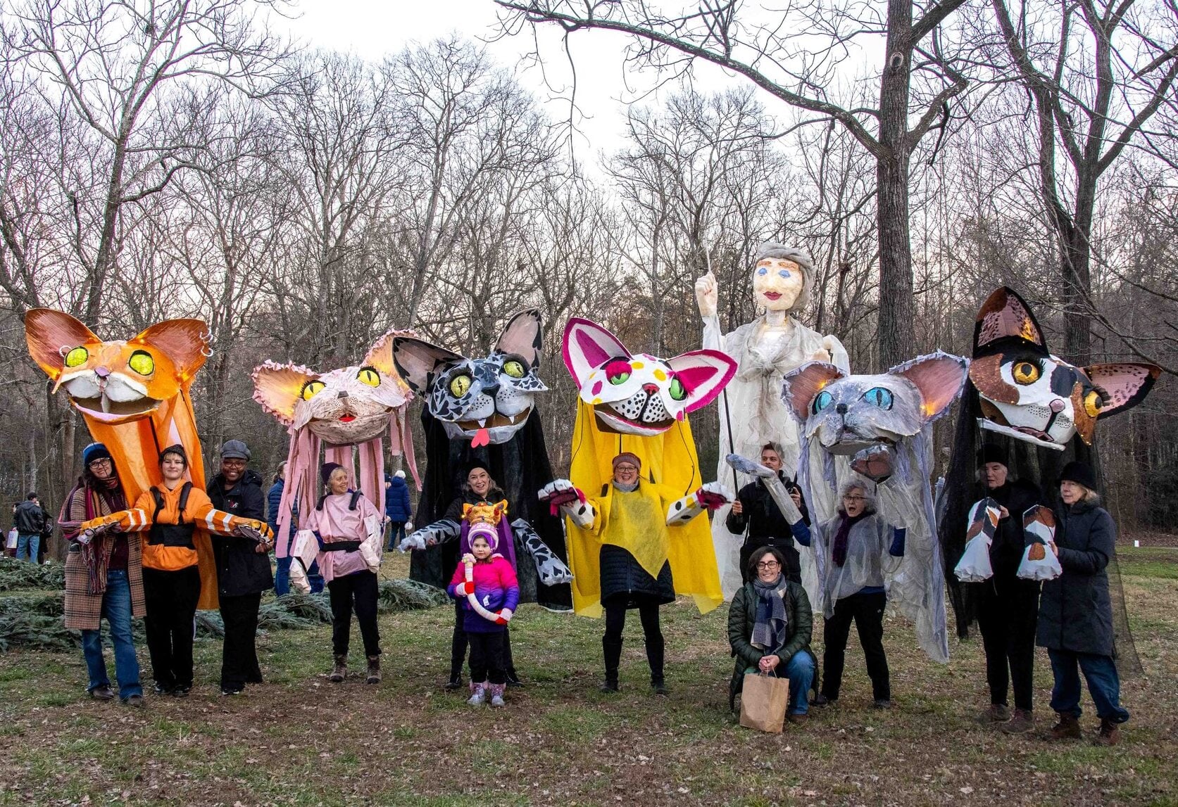 giant cat puppet lanterns with their handlers