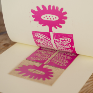 print of a flower using pink ink