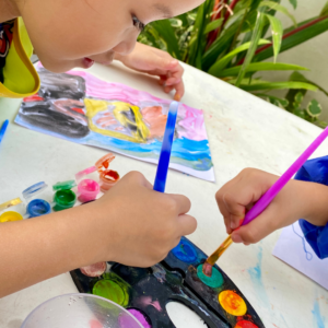 children painting with watercolors