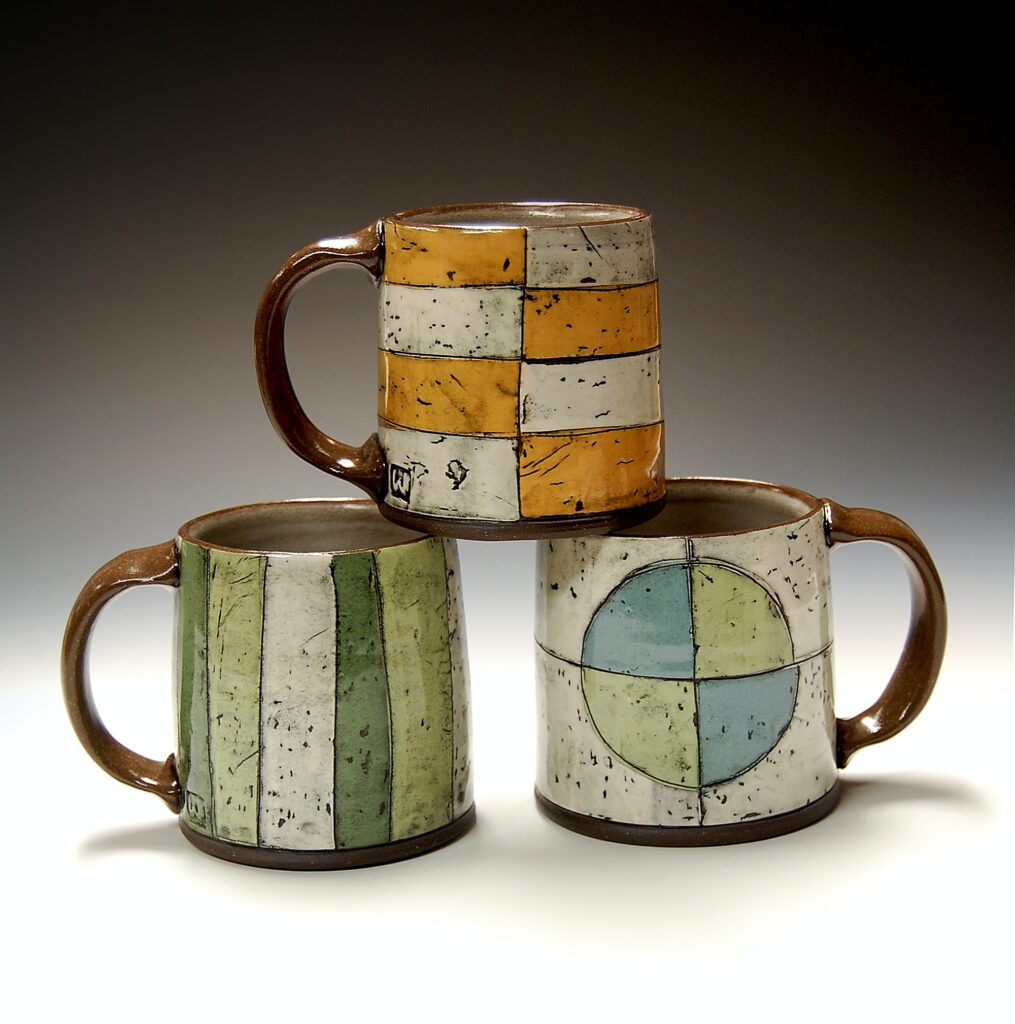 three handmade mugs