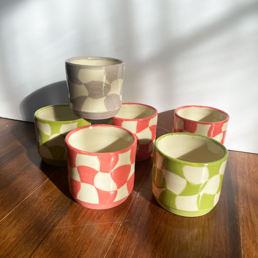 six cups stacked up together