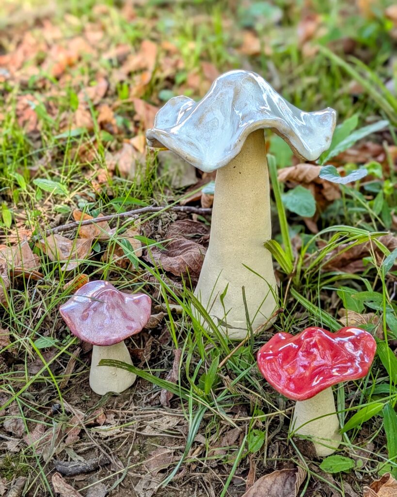 ceramic mushrooms in grass