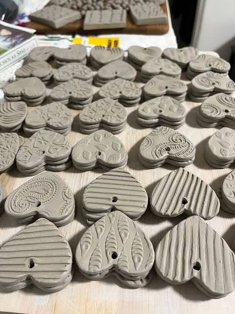clay hearts with patterns stamped in them
